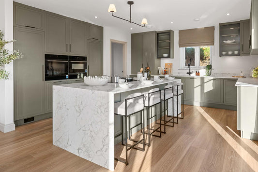 Modern kitchen with marble island and stainless steel appliances